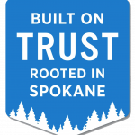 Badge saying Built on Trust Rooted in spokane